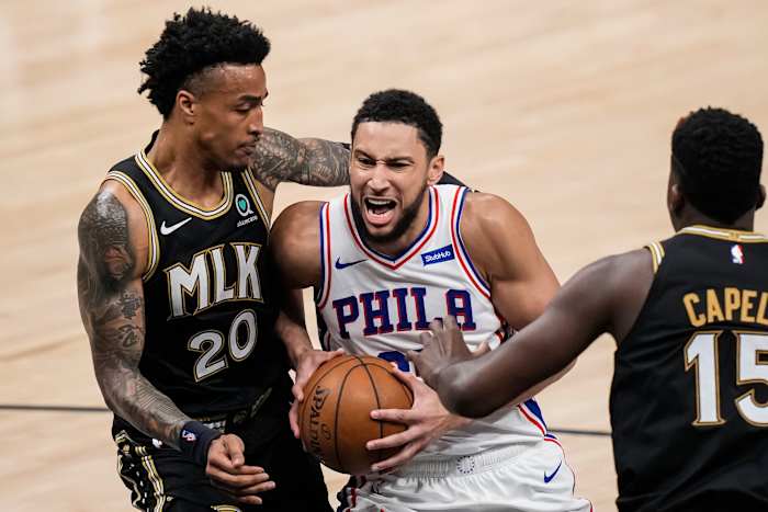 Jun 18, 2021; Atlanta, Georgia, USA; Philadelphia 76ers guard Ben Simmons (25) drives to the basket against Atlanta Hawks forward John Collins (20) during the first half in game six in the second round of the 2021 NBA Playoffs. at State Farm Arena.